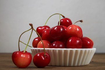 cherries ripe red fruit harvest vitamins wooden bowl