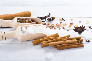 sugar variations with cinnamon and vanilla on white wood table background