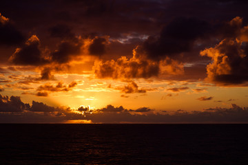 Beautiful sunset in atlantic ocean with amazing clouds