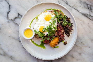 Gourmet bacon and eggs with marble background, Seminyak, bali