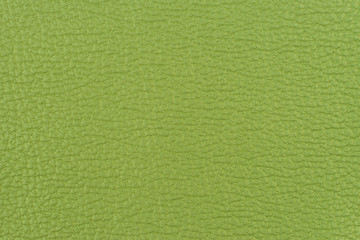 Fototapeta premium Green leather texture closeup, useful as background. Abstract background, empty template.