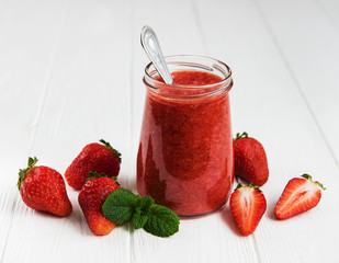 Jar with strawberry smoothie