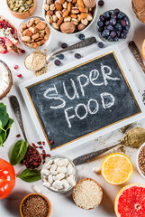 Set of organic healthy diet food, superfoods - beans, legumes, nuts, seeds, greens, fruit and vegetables.. white background copy space.