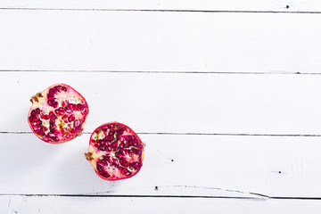 pomegranates on white wood table background