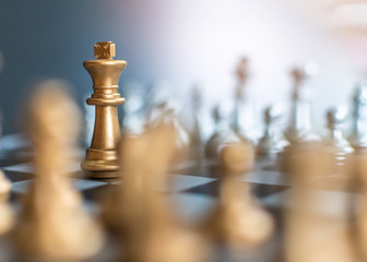 Business strategy competition, strategic planning for winning success and leadership management concept with chess leader on chessboard facing defender on opposite side