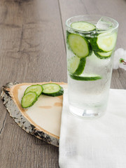 glass of cold detox with cucumber, refreshing summer drink