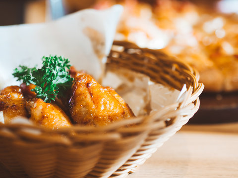 Fried Chicken Wings Served In Basket.