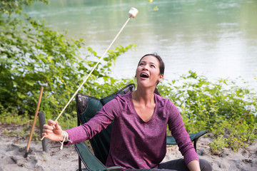 woman roasting marshmallow