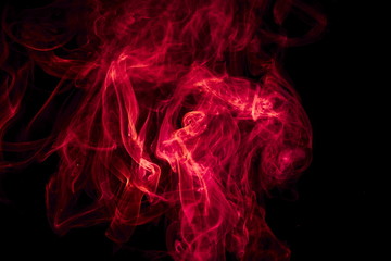 Obraz premium Red smoke on black background
