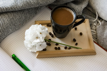 Delicious breakfast in bed with toast and a big cup of coffee