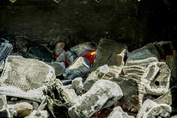 barbecue on the grill in the summer outdoors, ignition, burnt-out coal smoldering