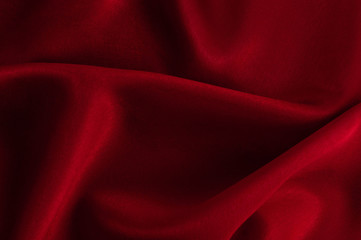 Abstract silk luxury background, piece of cloth, deep red cloth texture