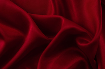 Abstract silk luxury background, piece of cloth, deep red cloth texture