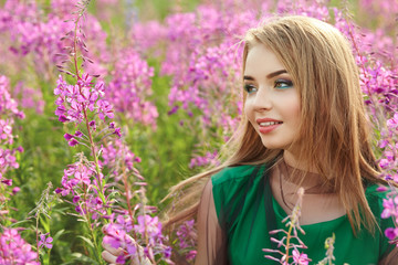 attractive girl in a field with flowers