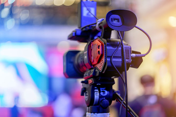 event camera in a event hall.  TV broadcast of the event from public space area