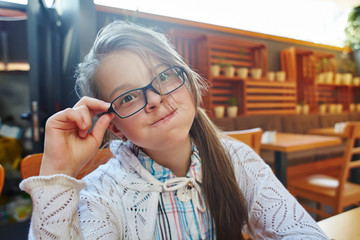 funny little girl with glasses