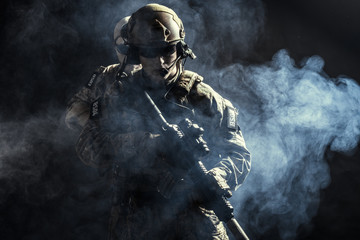 Group of security forces in Combat Uniforms with rifles