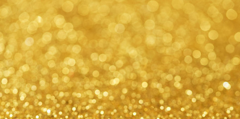 Gold bokeh background of glitter lights