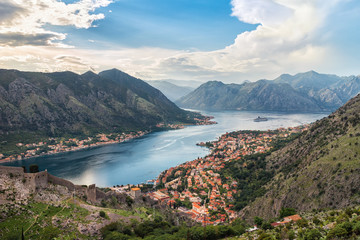 Obraz premium Panoramic view from above on the old city Kotor, bay in Adriatic sea and mountains in Montenegro at sunset time, gorgeous nature landscape