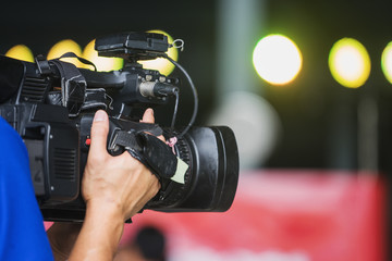 Video camera operator working with his equipment