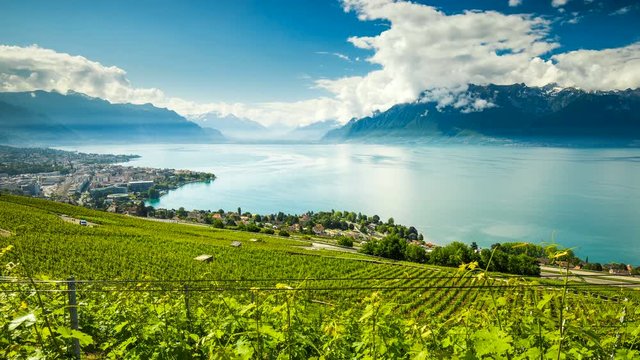 Timelapse panorama view of Montreux city with Swiss Alps, lake Geneva and vineyard on Lavaux region, Canton Vaud, Switzerland, Europe.

