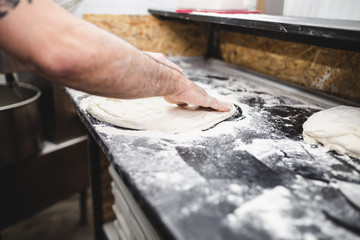 Close up shot of pizza making or preparing process