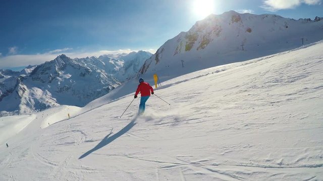 Man skiing on the prepared slope with fresh new powder snow in Rhaetian Alps
, Adamello, Tonale, Italy