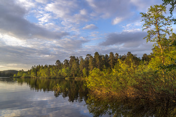 Summer landscape. Midnight sun and beautiful lake.