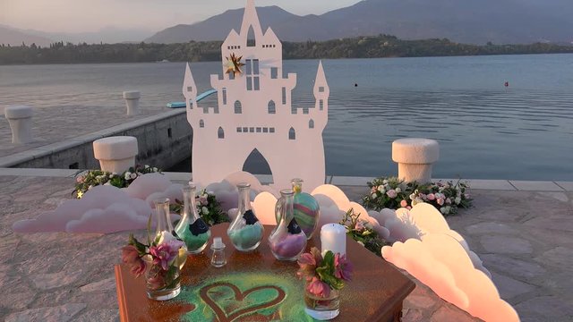 Glass vase filled with colored sand after the Wedding Sand Ceremony.  Kotor bay, Montenegro.