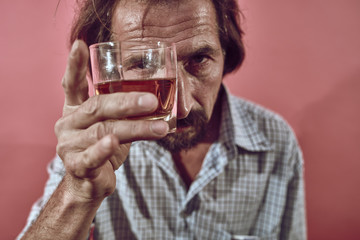 Husband's dependence on alcohol. Lace-up. A glass of whiskey. Pastel colors