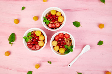 ..Healthy breakfast on white bowls.