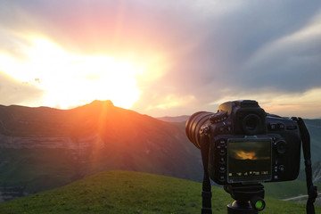 Camera on a tripod, shooting mountains scenery, mobile photo