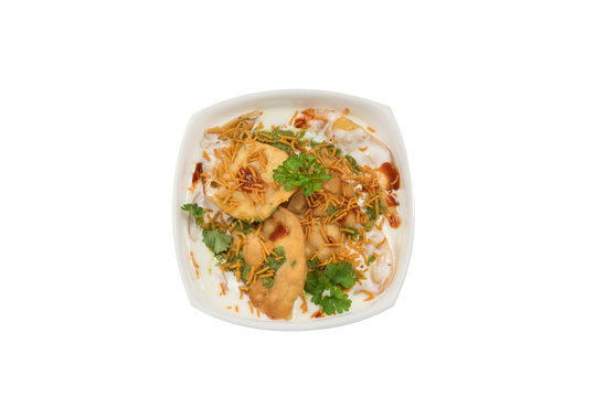 Traditional indian street food papdi chaat in white bowl isolated from background