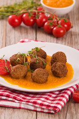 Meatballs with carrot purée.