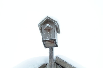 Old birdhouse. Russia, January, 2018. Close-up. Background.