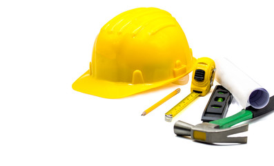 Yellow hard hat with blueprints and pencil,tape measure,hammer,construction bubble level isolated on white background,Copy space,with clipping Path