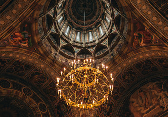 Majestic church architecture. The arched ceiling of the church and the majestic chandelier