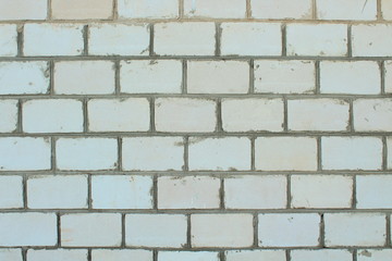 The wall of the house is made of white silicate brick. Close-up. Background. Texture.