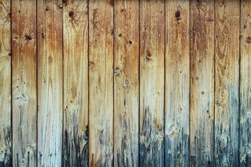The wall of the house is from old weathered dark boards. Close-up. Background. Texture.