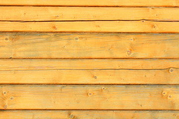 Naklejka premium The wall of the house is made of a square beam and a tow. Close-up. Background. Texture.