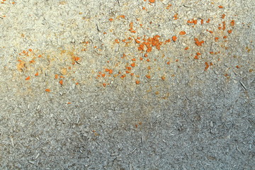 Old sheet of plywood with the remnants of red paint. Close-up. Background. Texture.