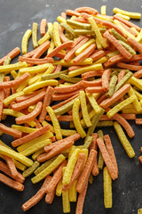 Vegetable healthy crisps, veggie chips, straws, puffs made of broccoli, beetroot, tomatoes, spinach and carrots with sea salt