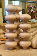 Wooden furniture legs in the form of turnips. Details wood production