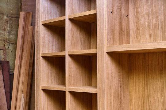Joinery. Oak veneered mdf wardrobe in workshop. Wooden furniture. Details wood production