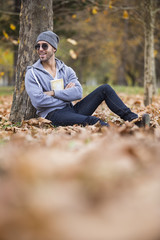 Fototapeta premium man in nature .autumn leaves.copy space