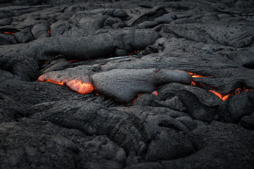 Red, molten, glowing lava flow near Hawaii's Kilauea volcano