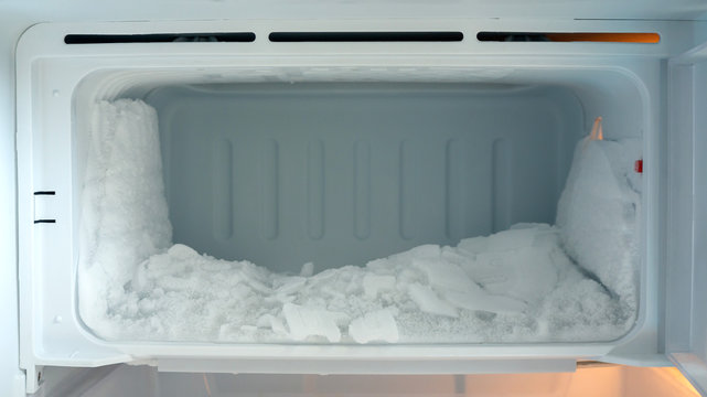 Ice buildup in an empty refrigerator.