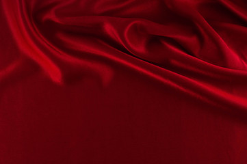 Abstract silk luxury background, piece of cloth, deep red cloth texture