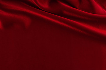 Abstract silk luxury background, piece of cloth, deep red cloth texture