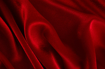 Abstract silk luxury background, piece of cloth, deep red cloth texture